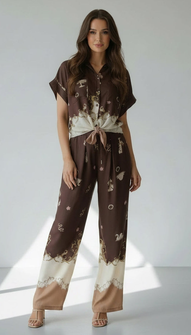 Woman wearing a brown and beige floral outfit on a white background